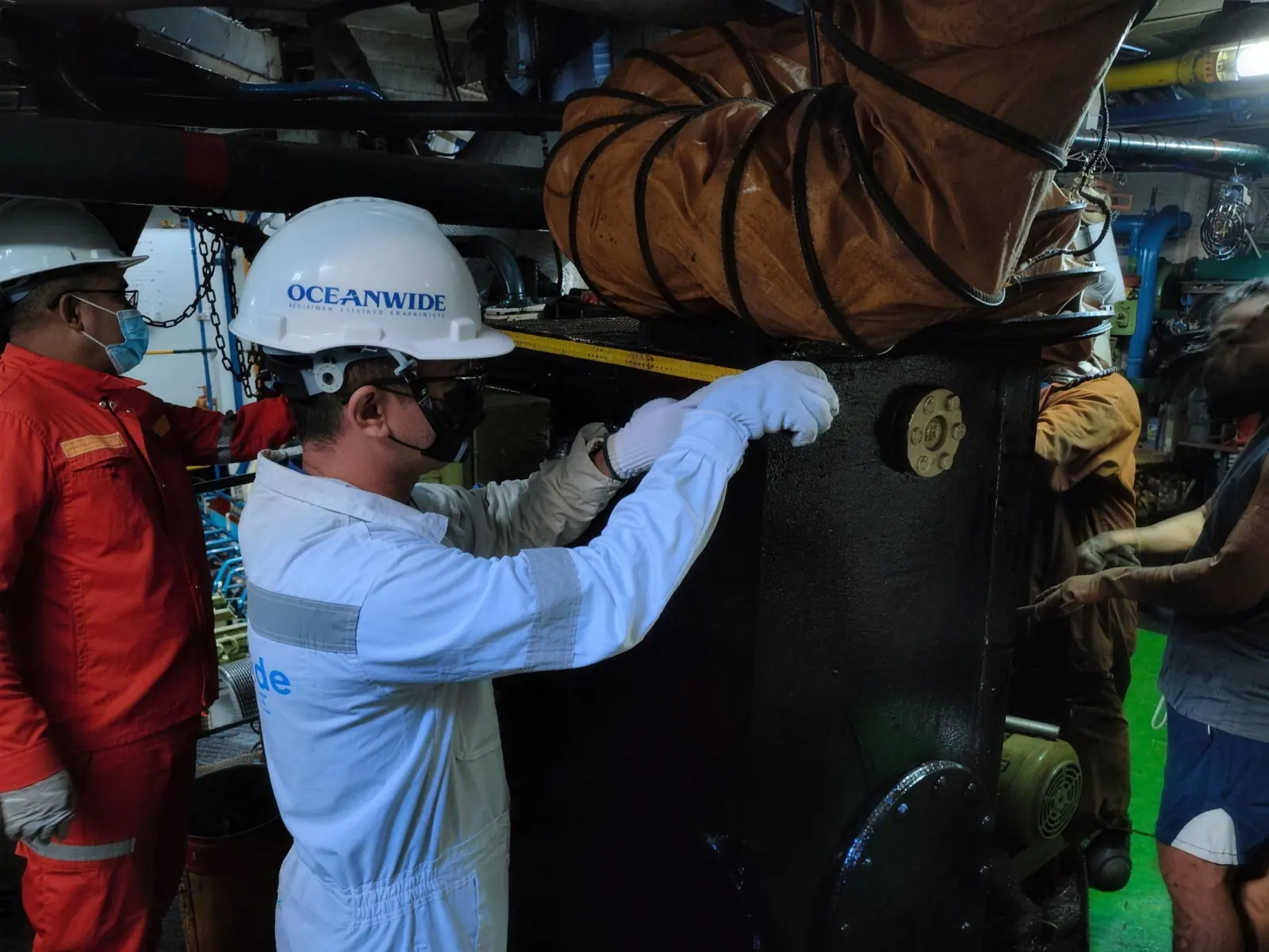 An Oceanwide surveyor and Coast Guard officer during a MARPOL survey